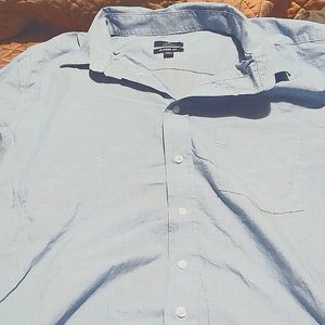 A very gently used baby blue long sleeved button up dress shirt 2xl George